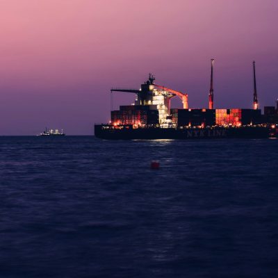 a large cargo ship in the middle of the ocean