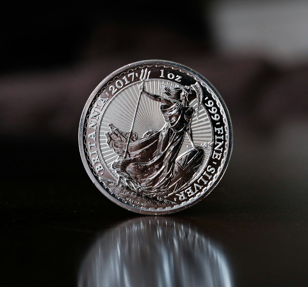 Photo by Osama Madlom a close up of a coin on a table